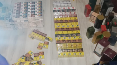 Percheziţie domiciliară în Sighetu Marmaţiei: Au fost confiscate numeroase parfumuri și pachete cu țigări de contrabandă